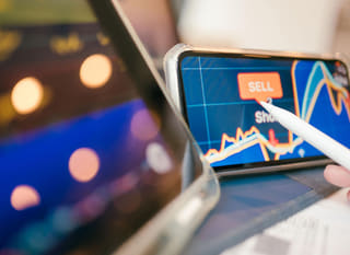 Trader working across multiple markets reviewing Bitcoin Ethereum and forex options